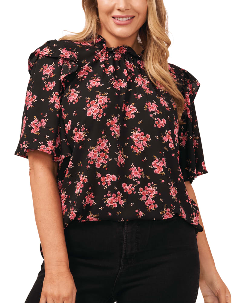 Front of a model wearing a size 1X Fay Flutter Sleeve Blouse in RICH BLACK by CeCe. | dia_product_style_image_id:263378